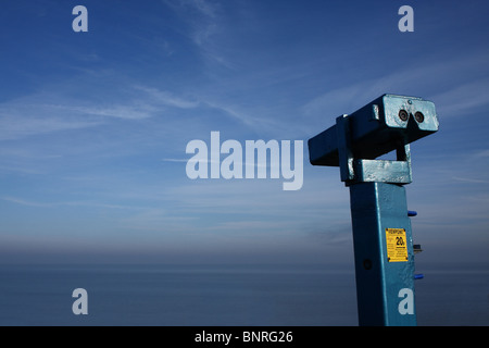 Coin-operated binoculars overlooking sea and sky