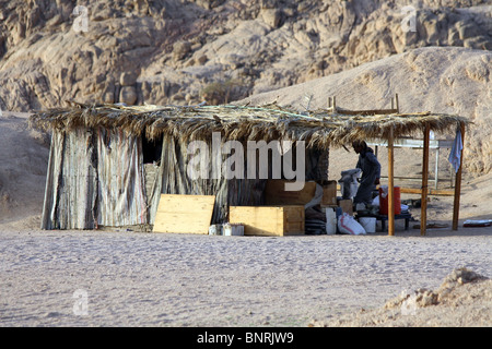 Man in shack under mountains in desert. Sharm el sheikh Egypt Stock Photo