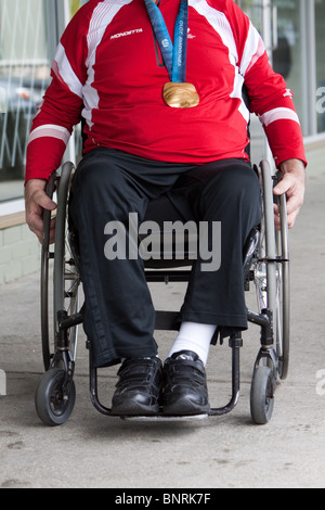 A Canadian Paralympian shows of his gold medal from the 2010 Winter Paralympic games in Vancouver. Stock Photo