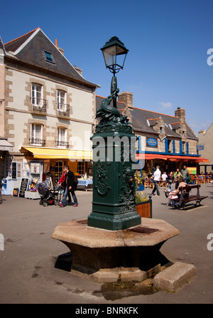 Ornate drinking fountain and Street Lamp  in Ville Close Concarneau France Europe Stock Photo