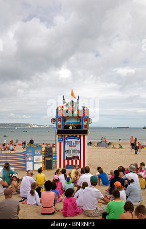 Traditional Punch & Judy show on Weymouth beach Stock Photo