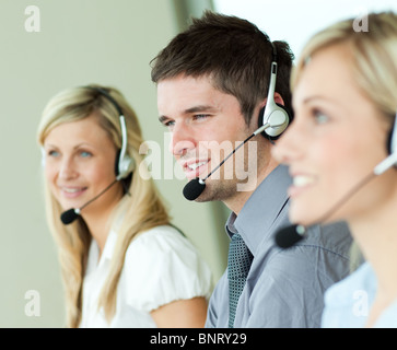 Young people working with headsets Stock Photo