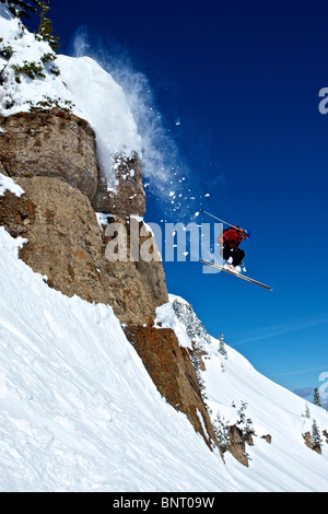 A man skis off a cliff in Wyoming. Stock Photo