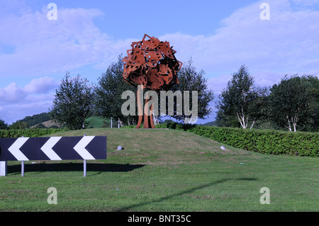 Rusty metal Oak tree gateway sculpture on the Llangunnor roundabout Carmarthen Caramrthenshire Wales Cymru UK GB Stock Photo