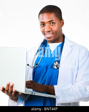 Young doctor working on a laptop Stock Photo