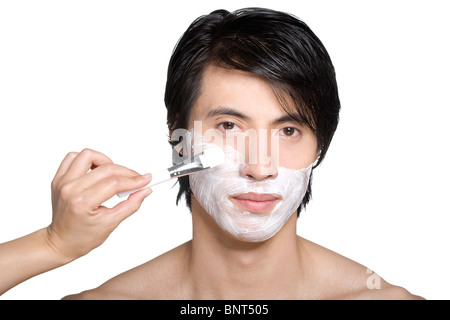 Handsome young man with facial mask Stock Photo