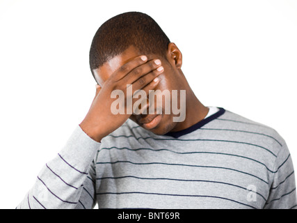 Stressed man with hand on his forehead Stock Photo