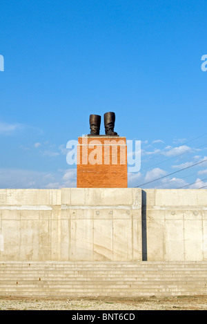 Bronze Boots Statue by Ákos Eleőd on Stalin's Grandstand at Memento Park (Szoborpark) in Budapest, Hungary Stock Photo