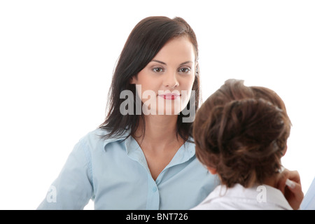 Business coaching concept. Young woman being interviewed for a job. Isolated on white background Stock Photo
