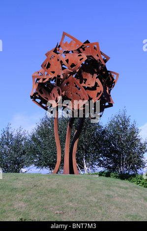 Rusty metal Oak tree gateway sculpture on the Llangunnor roundabout Carmarthen Caramrthenshire Wales Cymru UK GB Stock Photo