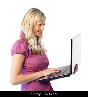 Cheerful woman working on a laptop Stock Photo