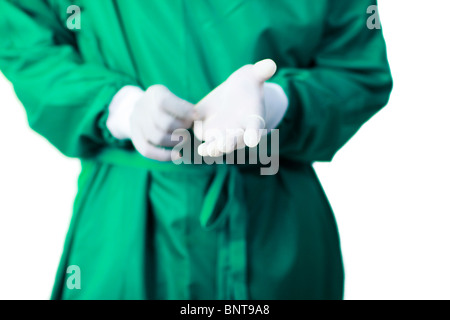 Surgeon putting on his gloves Stock Photo