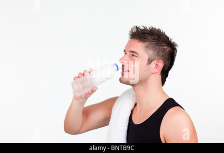 young Athlethic man drinking water Stock Photo
