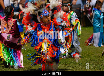 Young boy Native Indian Feather Dancer in tiny tots competition at Six Nations Reserve Pow Wow Grand River Ontario Stock Photo