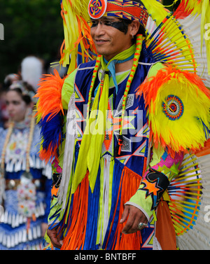 Native Indian male Fancy Dancer and girl in jingle dress at the Six Nations Reserve Pow Wow Grand River Ontario Canada Stock Photo