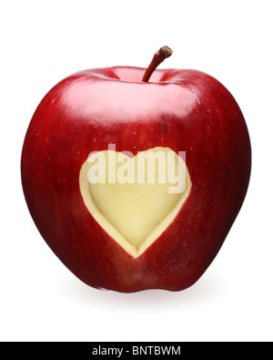 Heart shape carved out of red apple Stock Photo