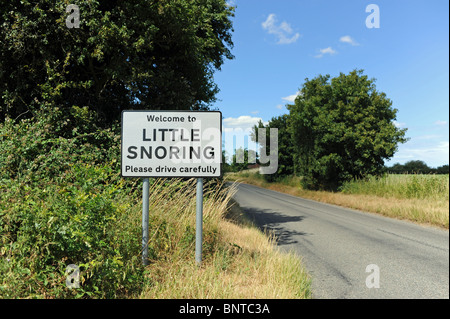 Welcome to Little Snoring Please Drive Carefully village sign in North Norfolk UK Stock Photo