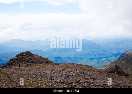 View from summit top of Scafell Pike, looking south towards South Peak with Harter Fell in the centre midground. Stock Photo