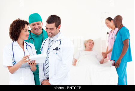 Positive doctor examining a patient Stock Photo