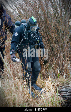 A police diver prepares to search a lake UK Stock Photo
