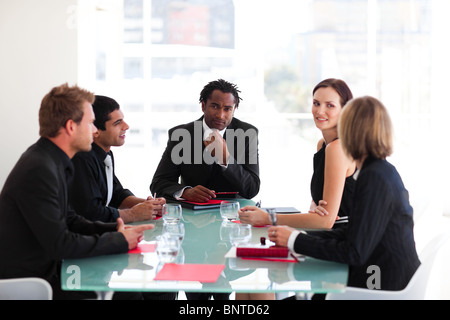 Thoughtful leadership looking at the camera in a meeting Stock Photo