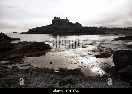 House silhouetted against the sky, overlooking the coast, Trearddur Bay, Anglesey, North Wales, UK Stock Photo