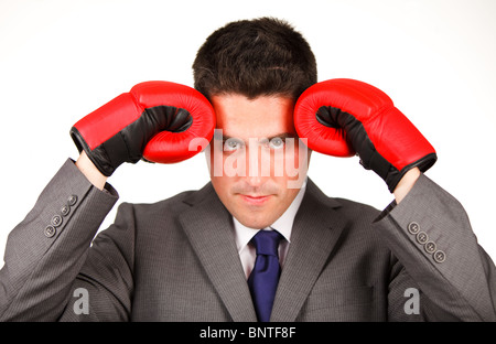 Stressed businessman with boxing gloves Stock Photo
