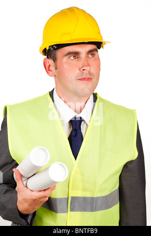 Male architect holding plans and wearing a hard hat Stock Photo
