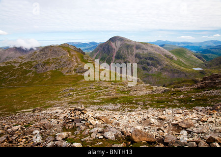 View from Scafell Pike, Lingmell in foreground, Great Gable centre and Styhead Tarn below, Derwent Water in far right distance. Stock Photo