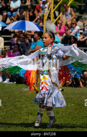 Young Native Indian girl on toes in the Fancy Shawl Dance competition at the Six Nations Reserve Pow Wow Grand River Ontario Stock Photo