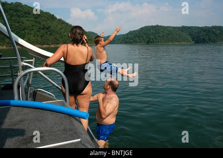 Going off houseboat slide on Lake Cumberland, KY. Stock Photo