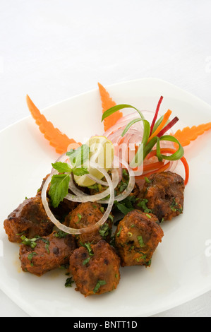 Mutton Boti Kebab - Tender morsels of kid lamb, marinated with traditional tandoori spices & honey & grilled on skewer Stock Photo