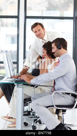 Senior manager in a call center looking at the camera Stock Photo