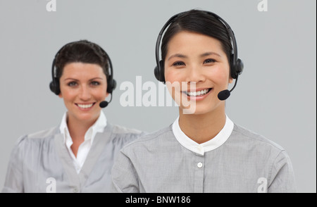 Two attractive businesswomen with headset on Stock Photo