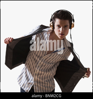 Male dancer listening to music on mp3 player Stock Photo