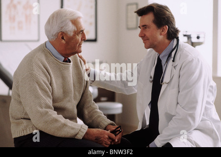 Doctor consulting with patient Stock Photo