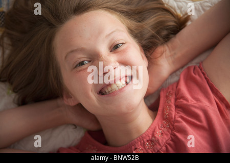 Young girl making cheesy smile