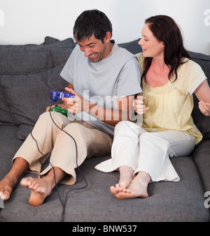Smiling couple playing video games Stock Photo