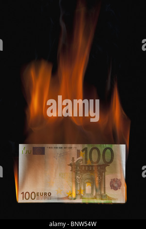 Burning 100 euro bill Stock Photo