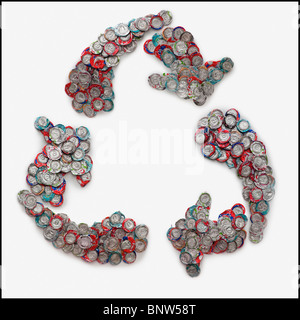 Crushed can arranged in the shape of recycle symbol Stock Photo