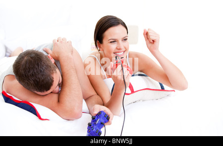 Happy couple playing video games Stock Photo