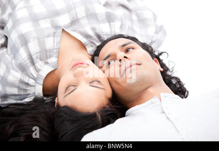 Pretty couple relaxing on the floor Stock Photo