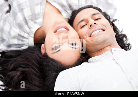 Laughing couple relaxing on the floor Stock Photo