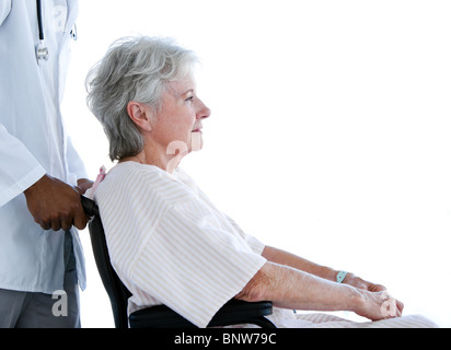 Portrait of a senior woman with a neck brace sitting on a wheelchair Stock Photo
