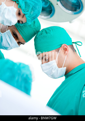 Multi-ethnic madical team working on a patient Stock Photo