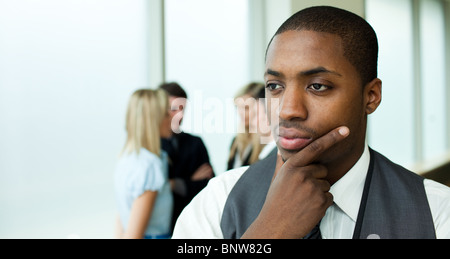 Thoughtful businessman in office Stock Photo
