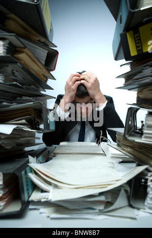 Desperate bookkeeper at work Stock Photo