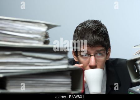Accountant drinking coffee at work Stock Photo