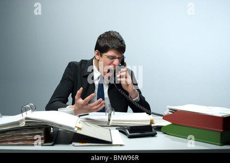 Bookkeeper making a phone call at work Stock Photo