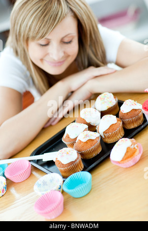 Woman preparing cakes in the kitchen Stock Photo